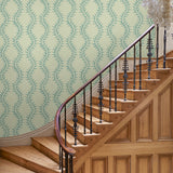 Luxurious wallpaper featuring stylised ferns and wavy lines in blue and cream.