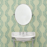 Luxurious wallpaper featuring stylised ferns and wavy lines in blue and cream.