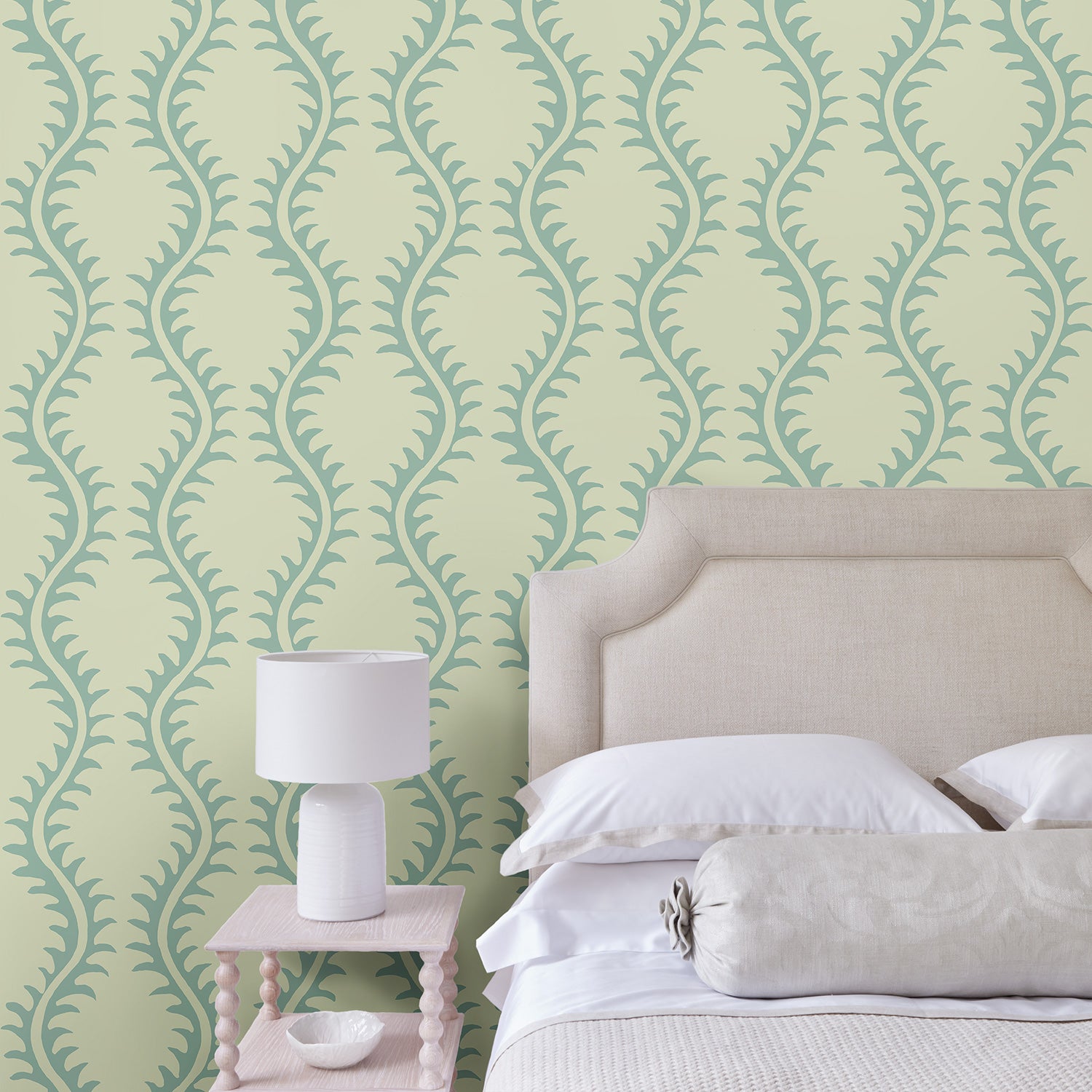 Luxurious wallpaper featuring stylised ferns and wavy lines in blue and cream.