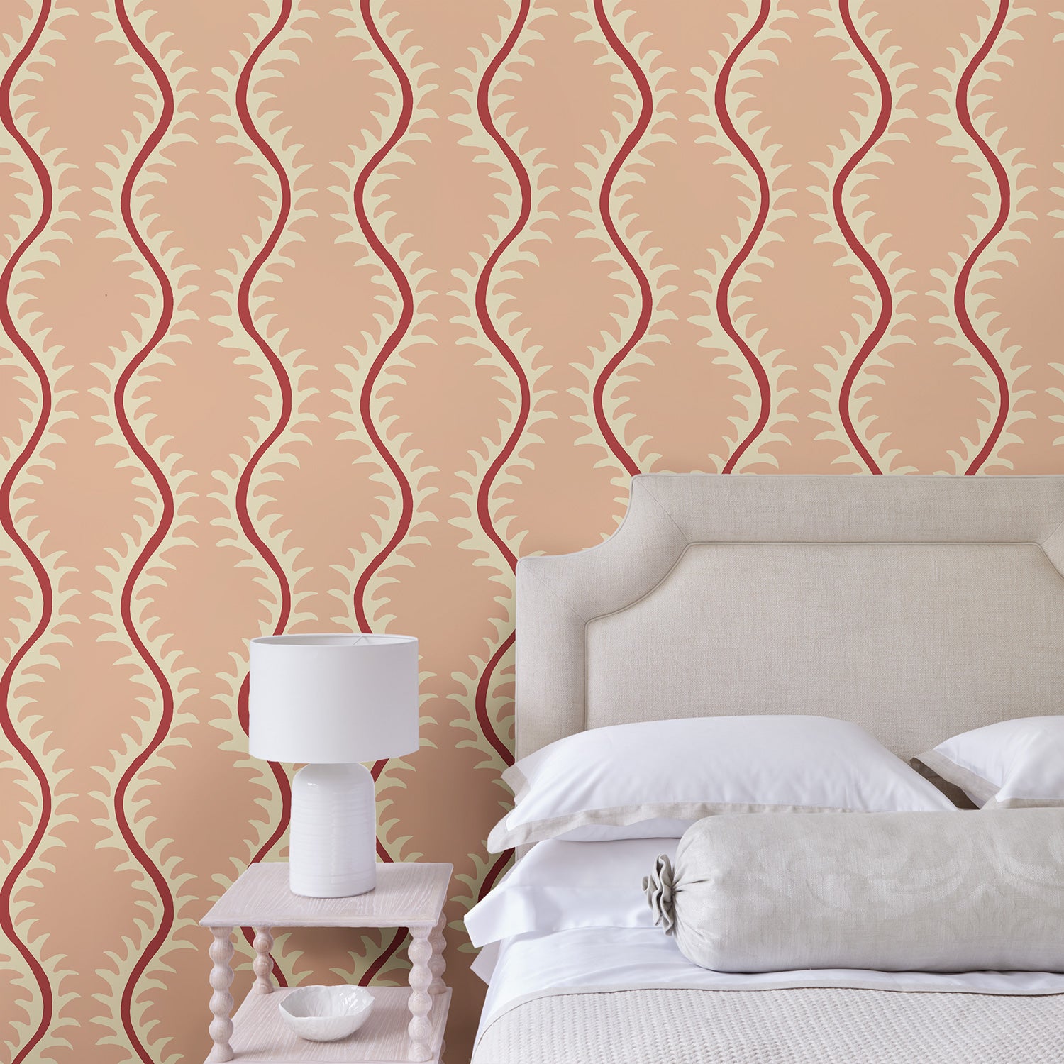 Luxurious wallpaper featuring stylised ferns and wavy lines in pink and red.