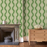 Luxurious wallpaper featuring stylised ferns and wavy lines in green and cream.