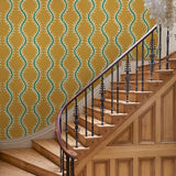 Luxurious wallpaper featuring stylised ferns and wavy lines in yellow and green.