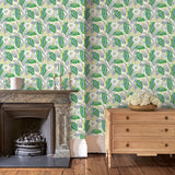 Living room with a green floral wallpaper.