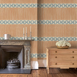 Sitting room with a chain-link wallpaper with different-sized blue and brown stripes.