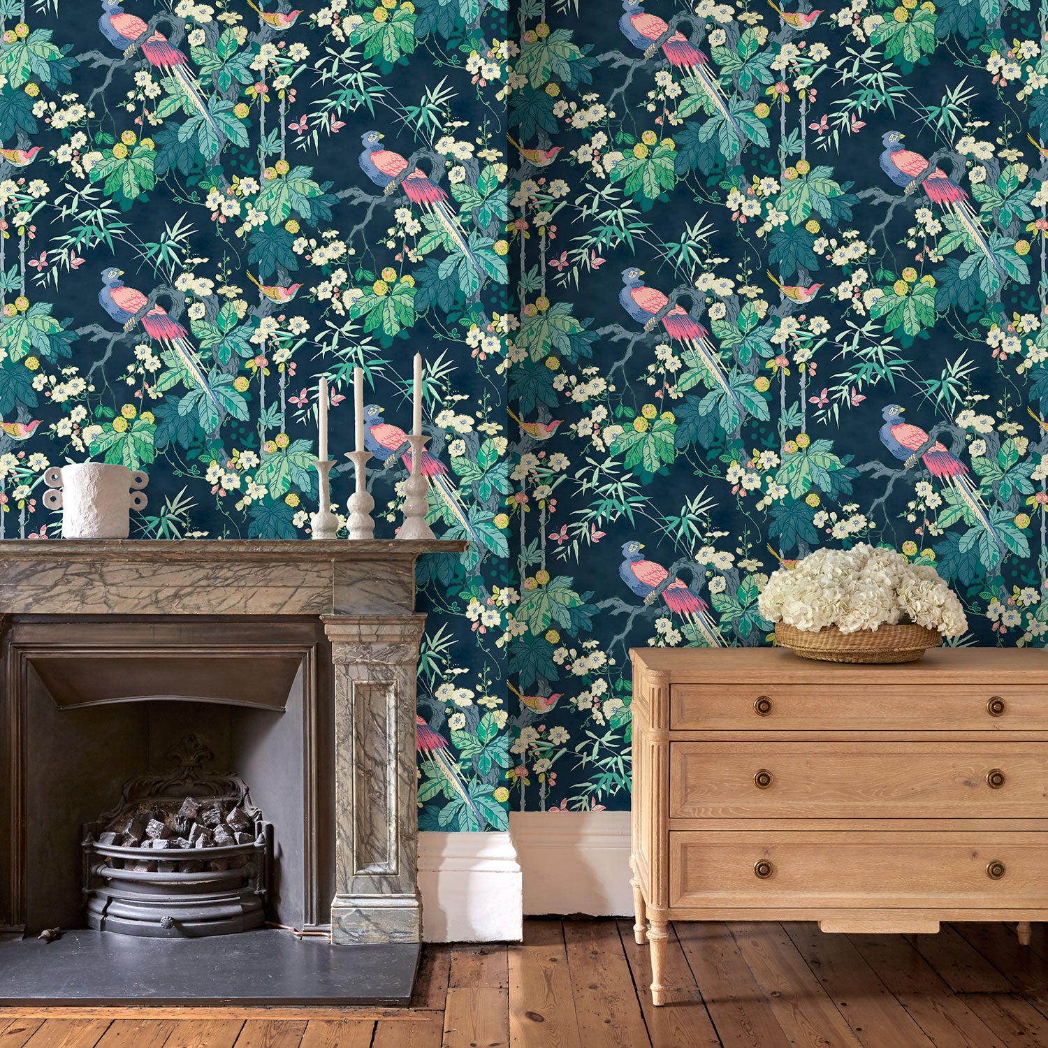 Living room featuring a navy floral wallpaper with exotic birds.