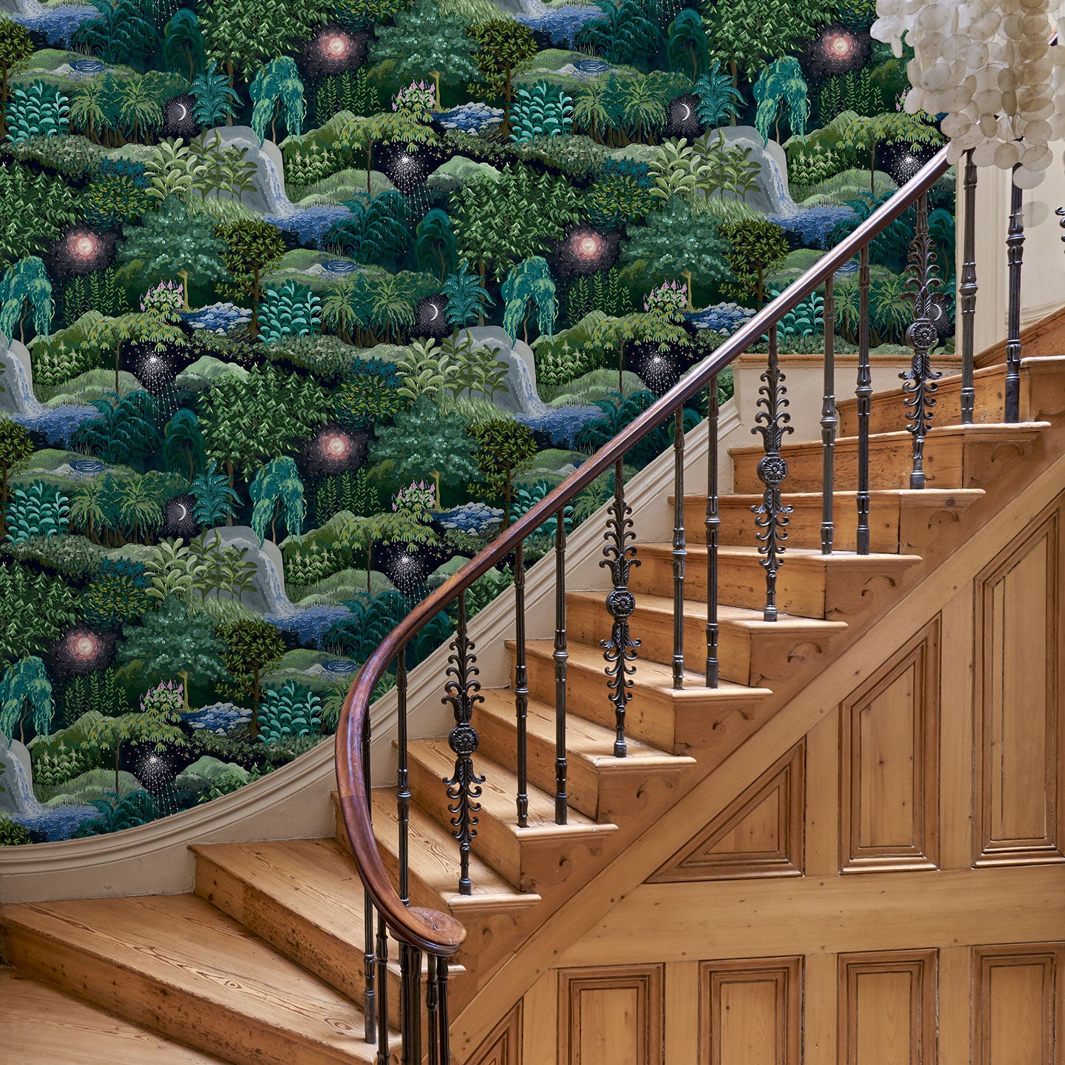 Hallway with a designer abstract wallpaper featuring a night-time forest design.