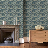 Sitting room with a blue geometric wallpaper.