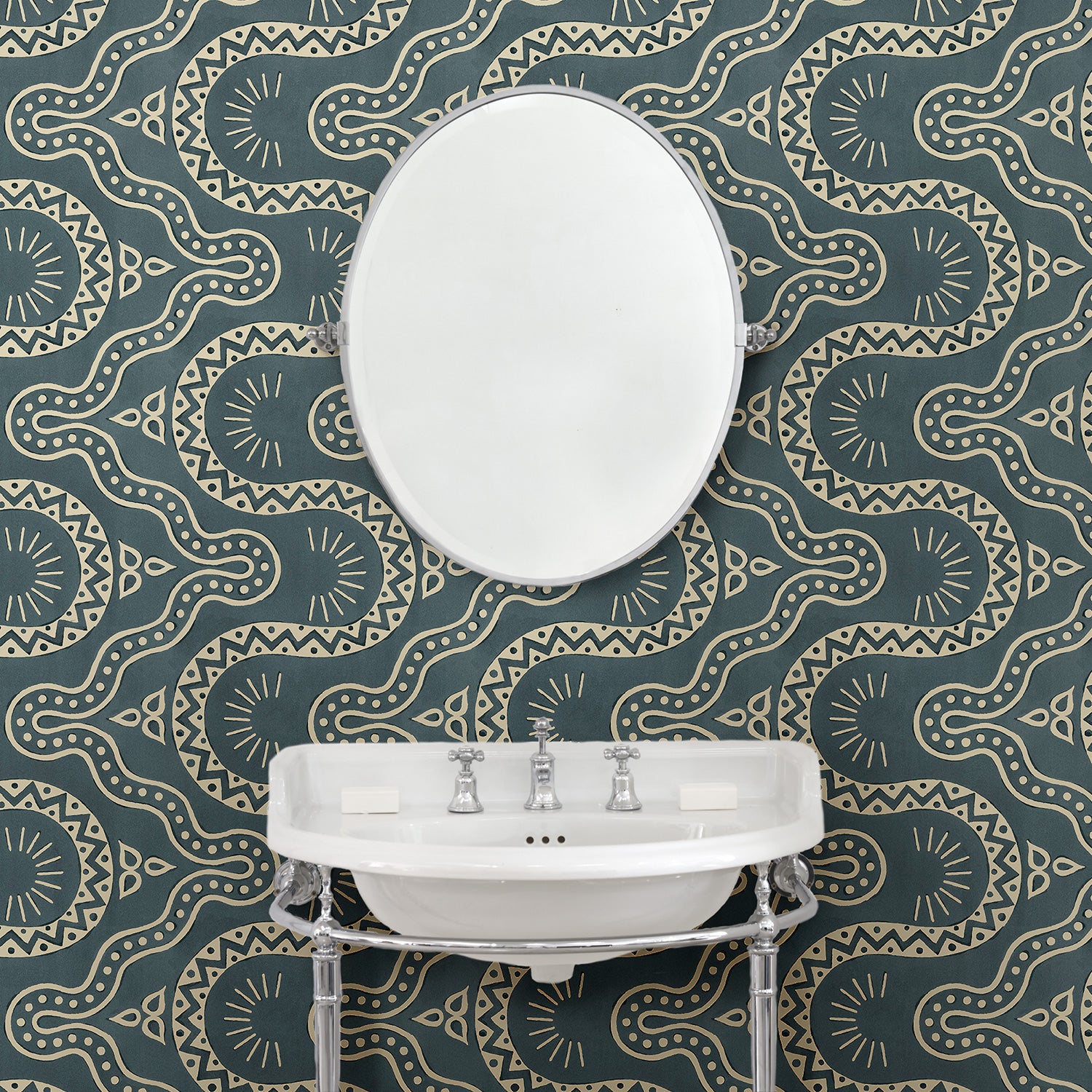Bathroom with a blue geometric wallpaper.