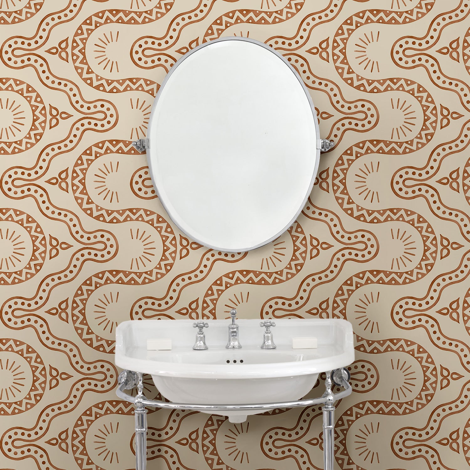 Cloakoom with a brown geometric wallpaper.