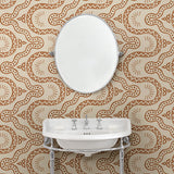 Cloakoom with a brown geometric wallpaper.
