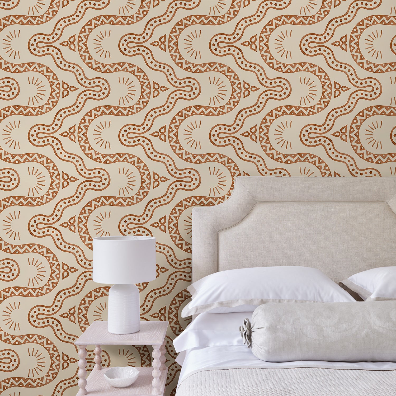 Bedroom with a brown geometric wallpaper.