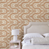 Bedroom with a brown geometric wallpaper.
