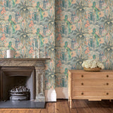 Tropical wallpaper in blue, shown in a sitting room.
