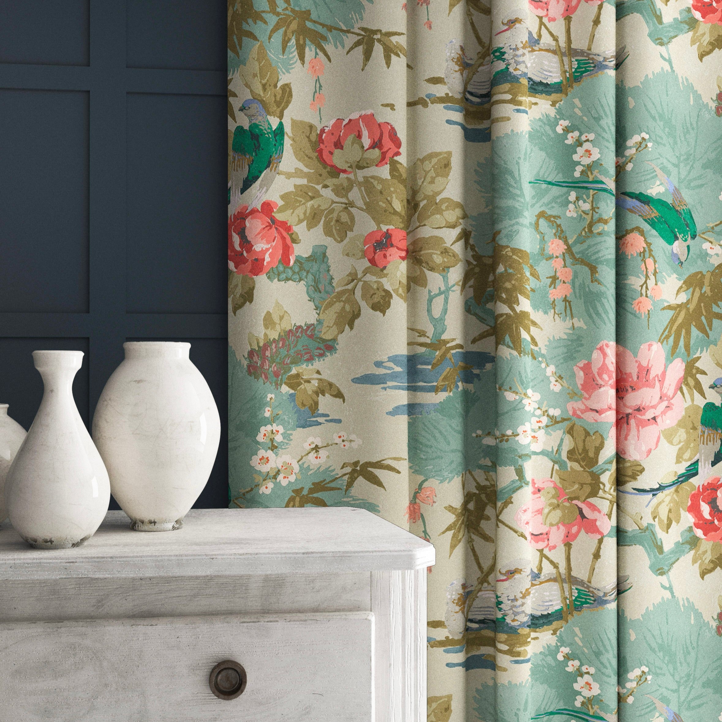 Velvet curtains in an ivory and pink floral pattern.