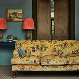 A printed velvet fabric showcasing lively horses and bedecked warriors in brown on a sofa