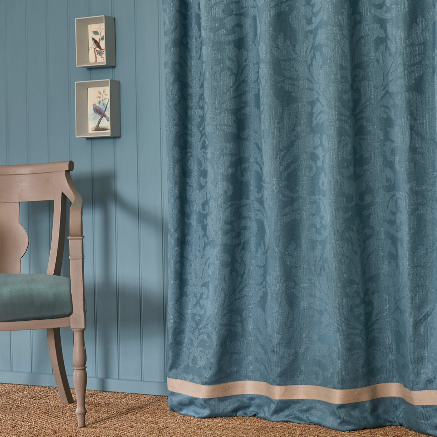 Curtain in a contemporary damask fabric in a blue colour.