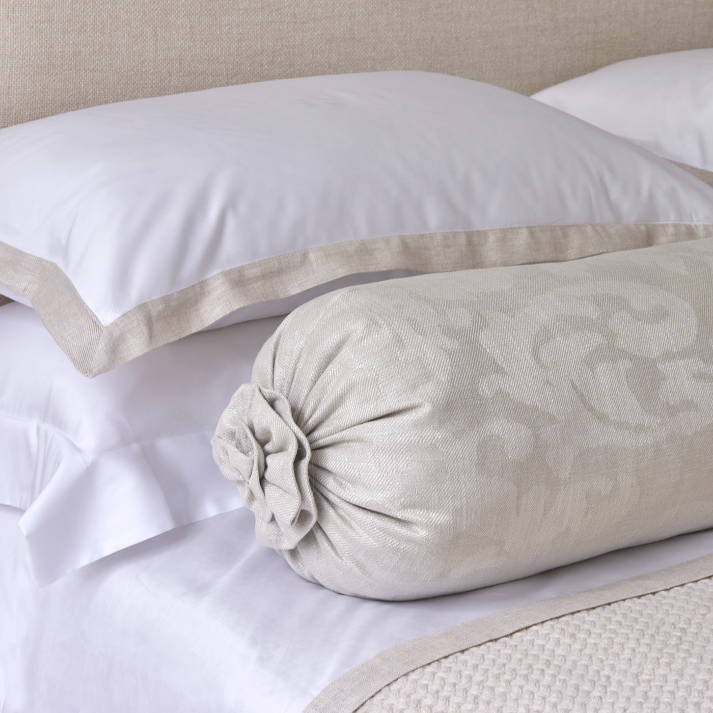 Pillow in a contemporary damask fabric in a cream colour.