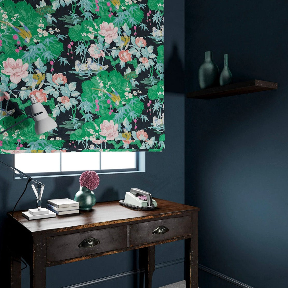 Velvet blind in an aqua coloured floral pattern.