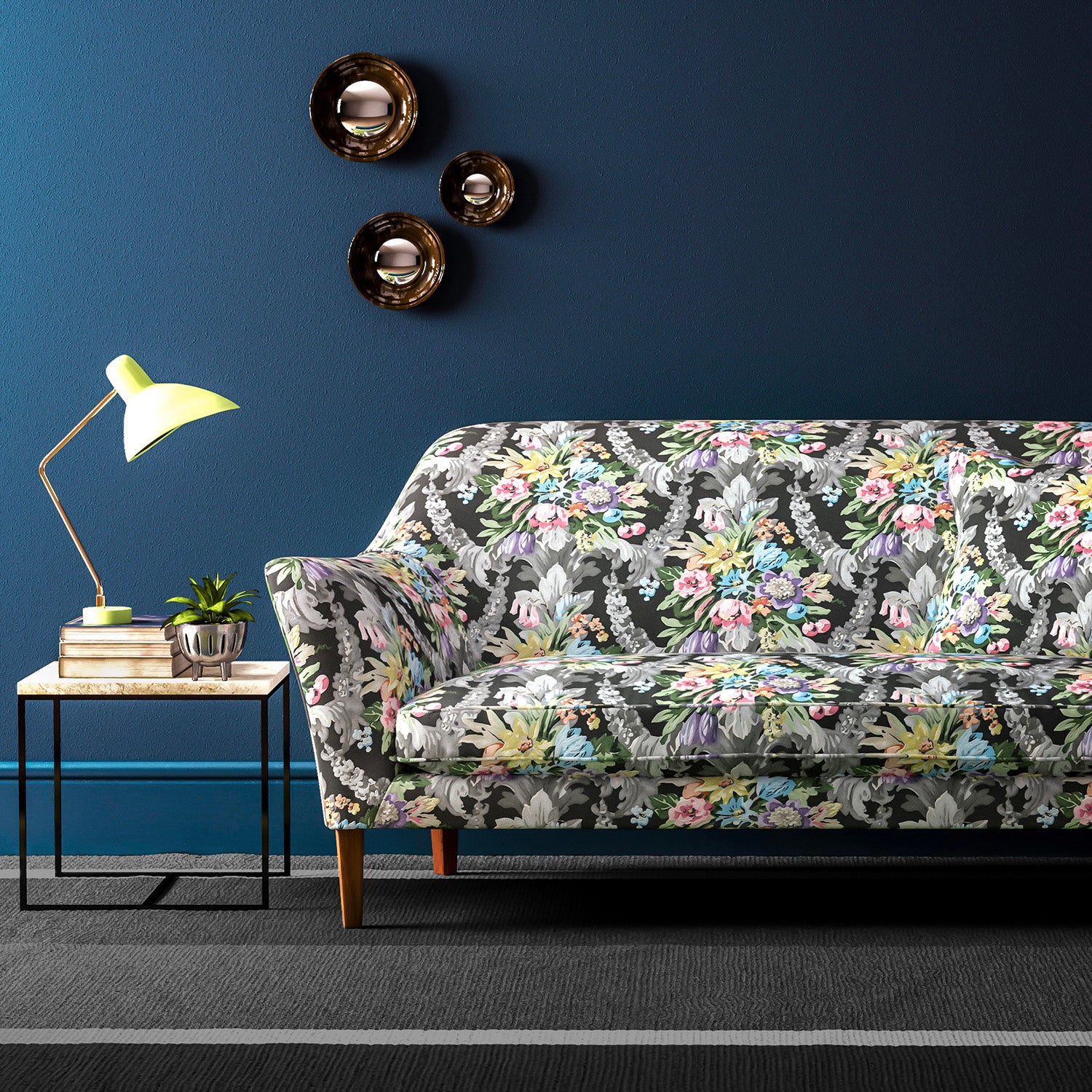 Sofa upholstered in a velvet upholstery fabric with stain resistant finish and vibrant colourful flower bouquet