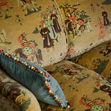 A printed velvet fabric showcasing lively horses and bedecked warriors in brown on a sofa