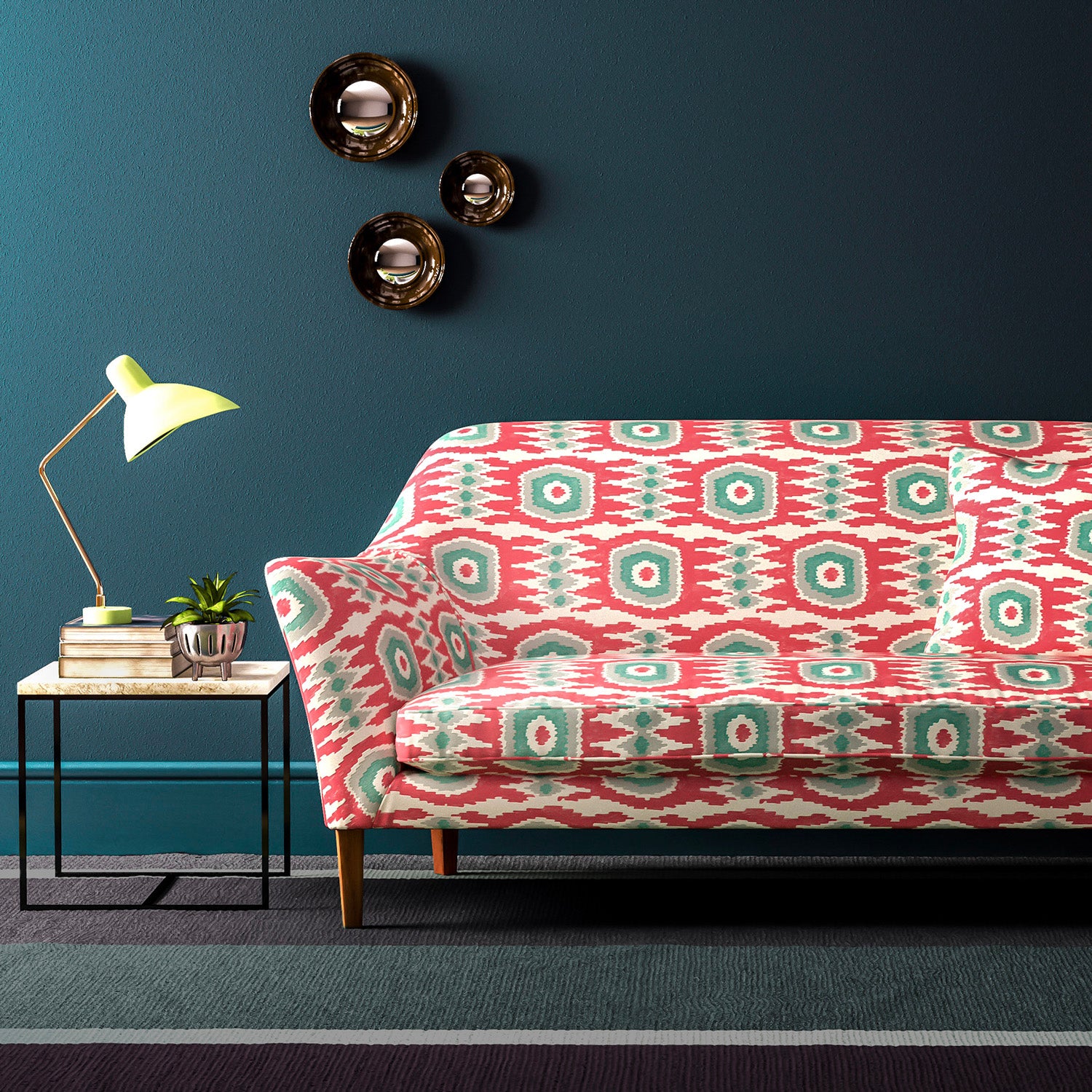 Sofa covered in a printed velvet upholstery fabric featuring a fun, jazzy pattern in Mandarin Orange. 