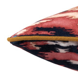 Velvet scatter cushion in a red and navy painterly-style pattern