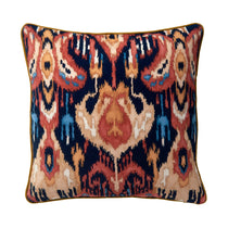 Velvet scatter cushion in a red and navy painterly-style pattern