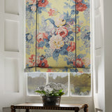Blind in a printed linen fabric with bouquets of roses on a yellow background.