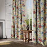 Curtains in a printed linen fabric with bouquets of roses on a yellow background.