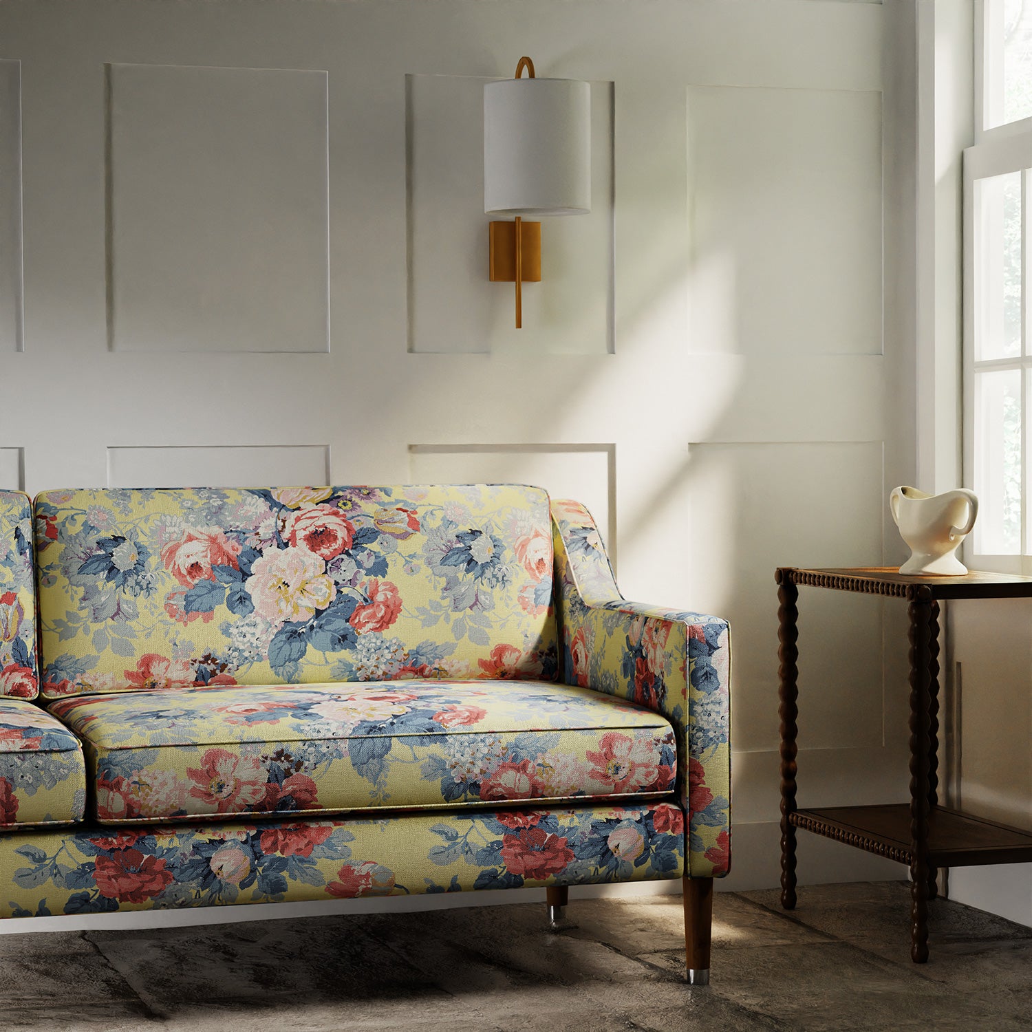 Sofa in a printed linen fabric with bouquets of roses on a yellow background.
