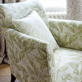 Chair upholstered in a luxury light green floral and leaf fabric