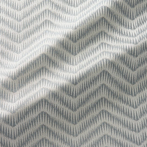 Fabric swatch of a herringbone weave design in neutral colours, suitable for curtains and upholstery