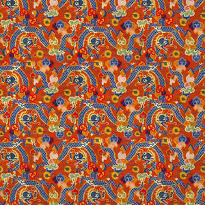 Printed velvet fabric with intricate mirror dragon design in orange colours, for upholstery and curtain use.