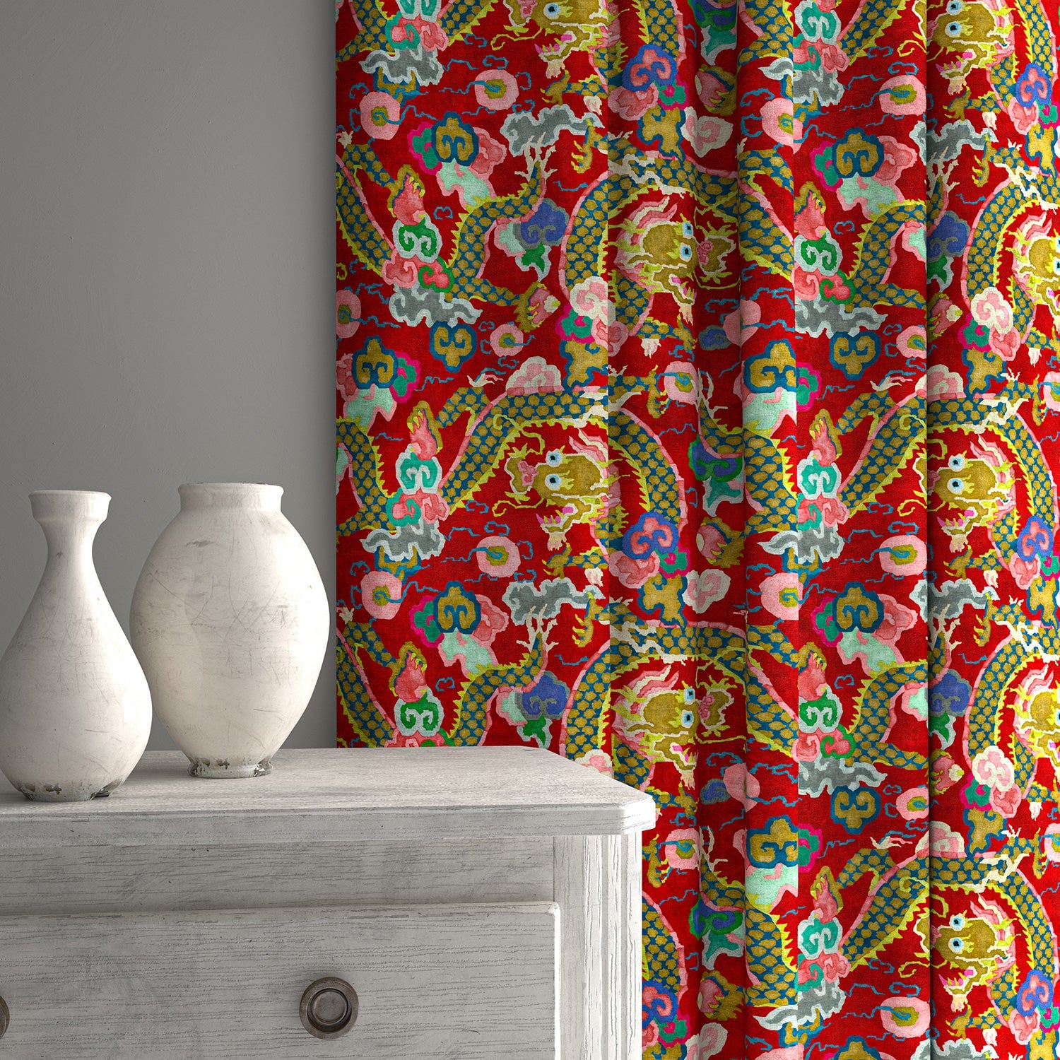Velvet curtains upholstered in a printed velvet fabric with a intricate mirror dragon design in red colours.