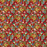 Printed velvet fabric with intricate mirror dragon design in red colours, for upholstery and curtain use.