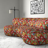 Velvet sofa upholstered in a printed velvet fabric with a intricate mirror dragon design in red colours.