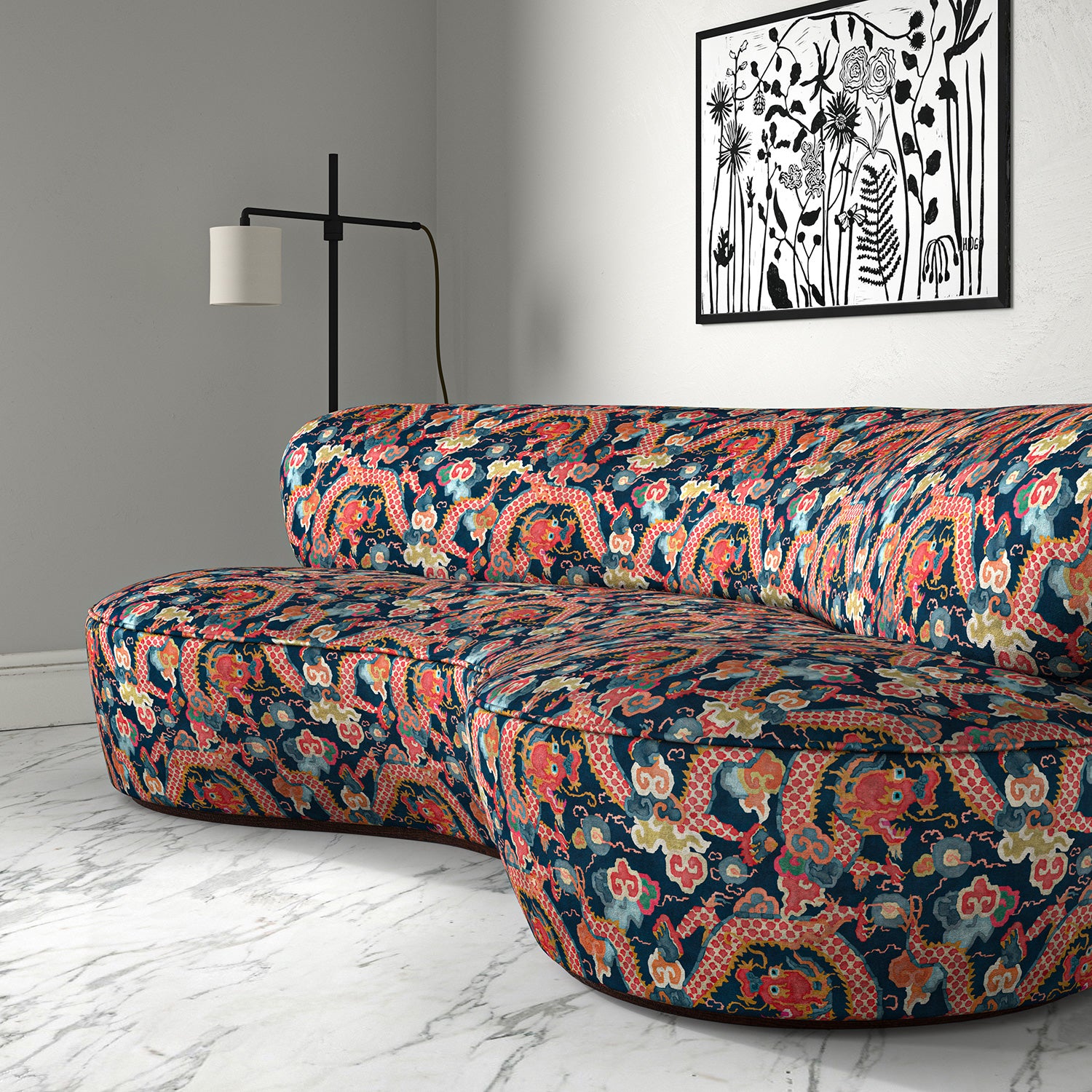 Velvet sofa upholstered in a printed velvet fabric with a intricate mirror dragon design in blue and orange colours.