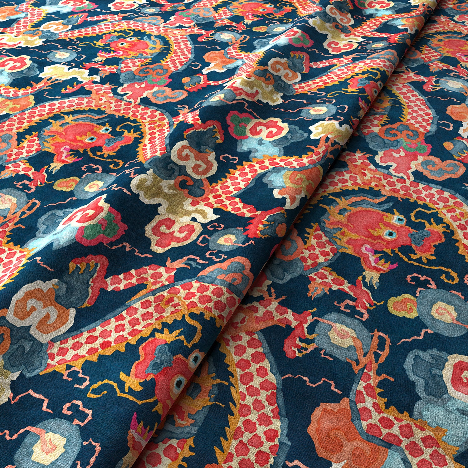 Printed velvet fabric with intricate mirror dragon design in orange and blue colours, for upholstery and curtain use.