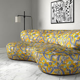 Velvet sofa upholstered in a printed velvet fabric with a intricate mirror dragon design in yellow colours.