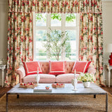 Curtains in a printed linen fabric with bouquets of red roses.