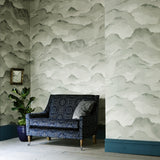 Sitting room with an abstract wallpaper in a monotone colourway.