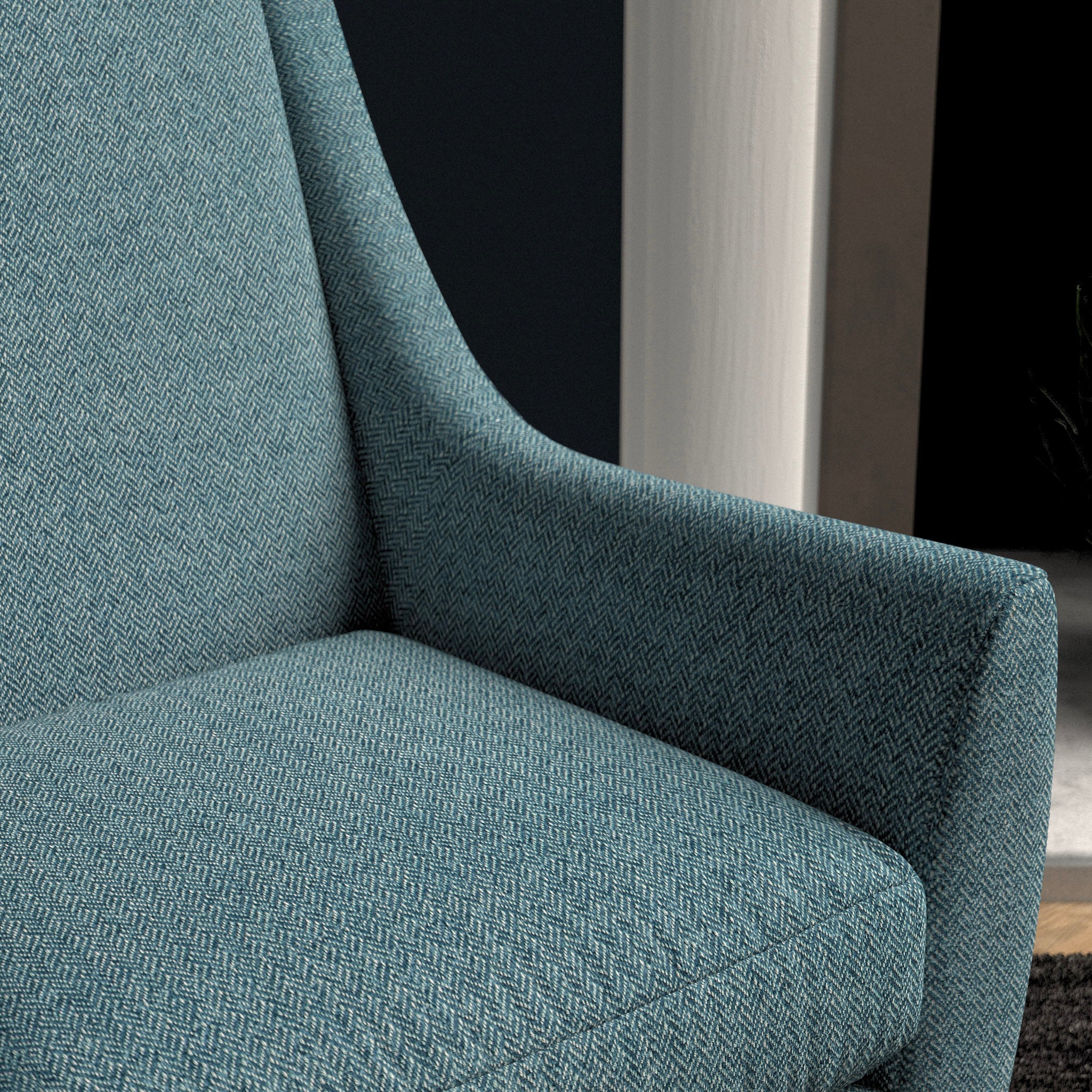 Chair upholstered in a blue herringbone wool weave upholstery fabric