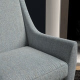 Chair upholstered in a light blue herringbone wool weave upholstery fabric