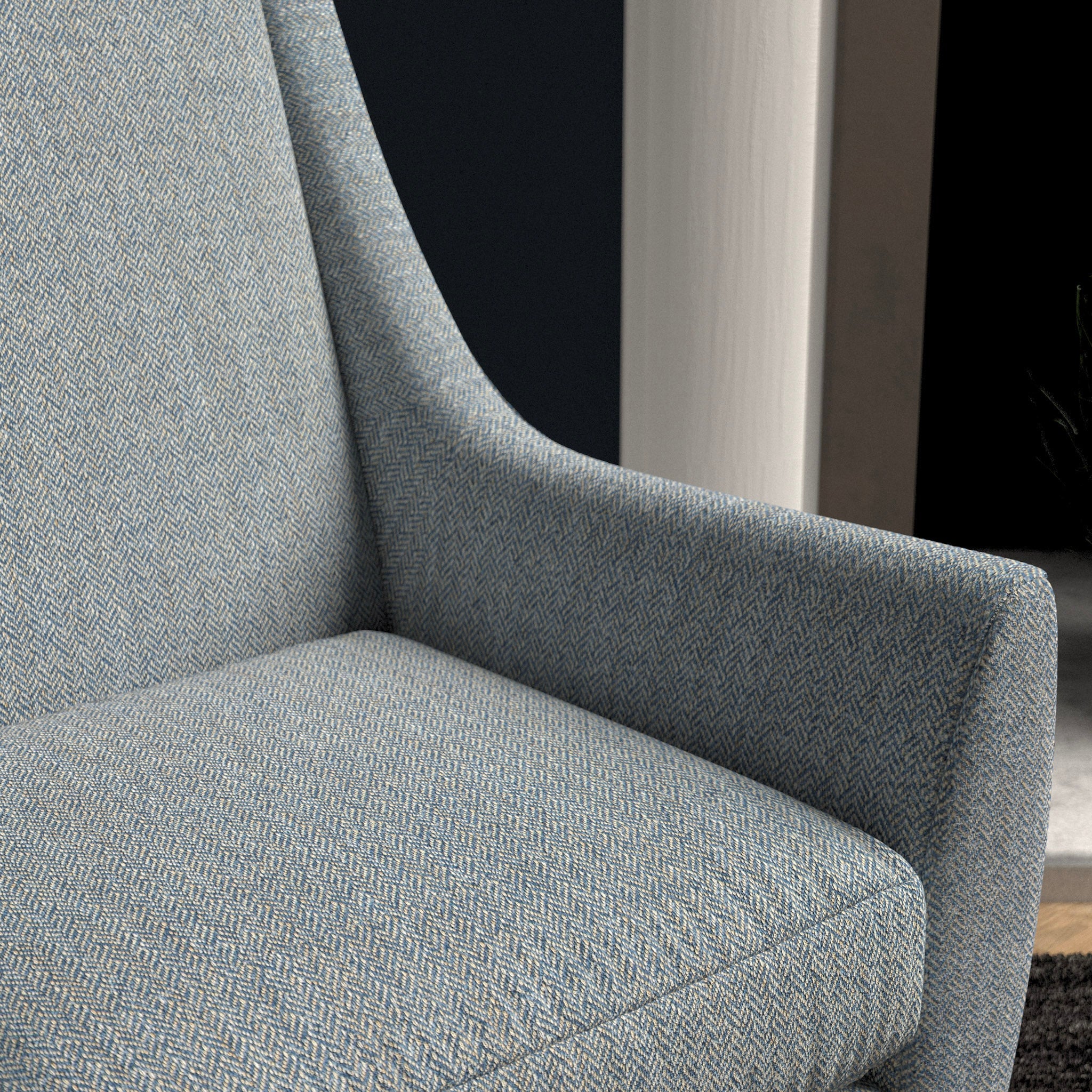 Chair upholstered in a light blue herringbone wool weave upholstery fabric