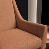 Chair upholstered in a bright orange herringbone wool weave upholstery fabric