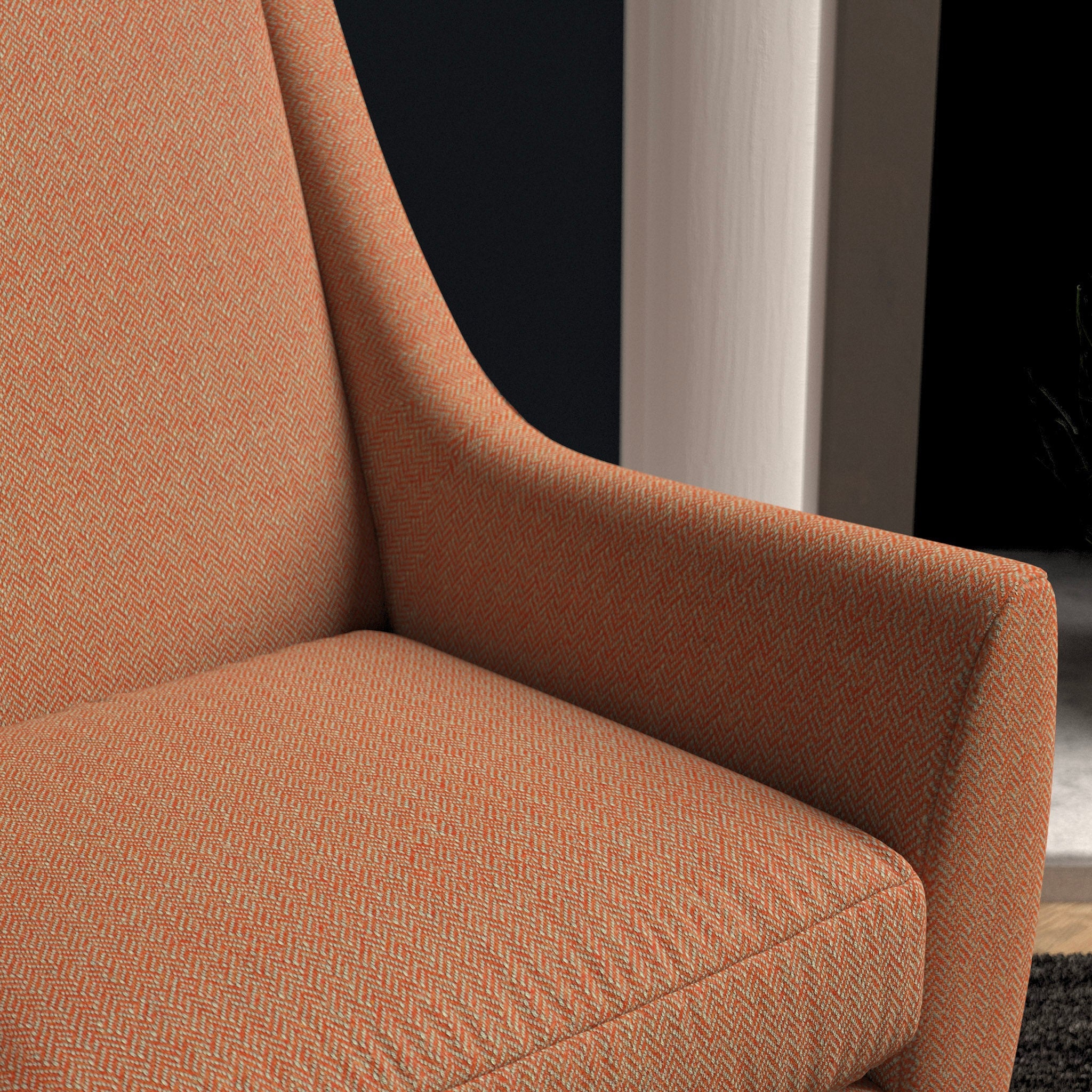 Chair upholstered in a bright orange herringbone wool weave upholstery fabric