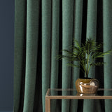 Curtain in a seagreen herringbone wool fabric