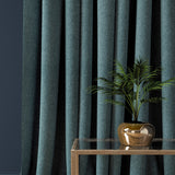 Curtain in a aqua blue herringbone wool fabric