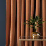 Curtain in a bright orange herringbone wool fabric