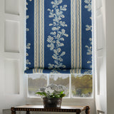 Blind in a printed linen fabric with blue and white stripes and an oak-leaf motif.